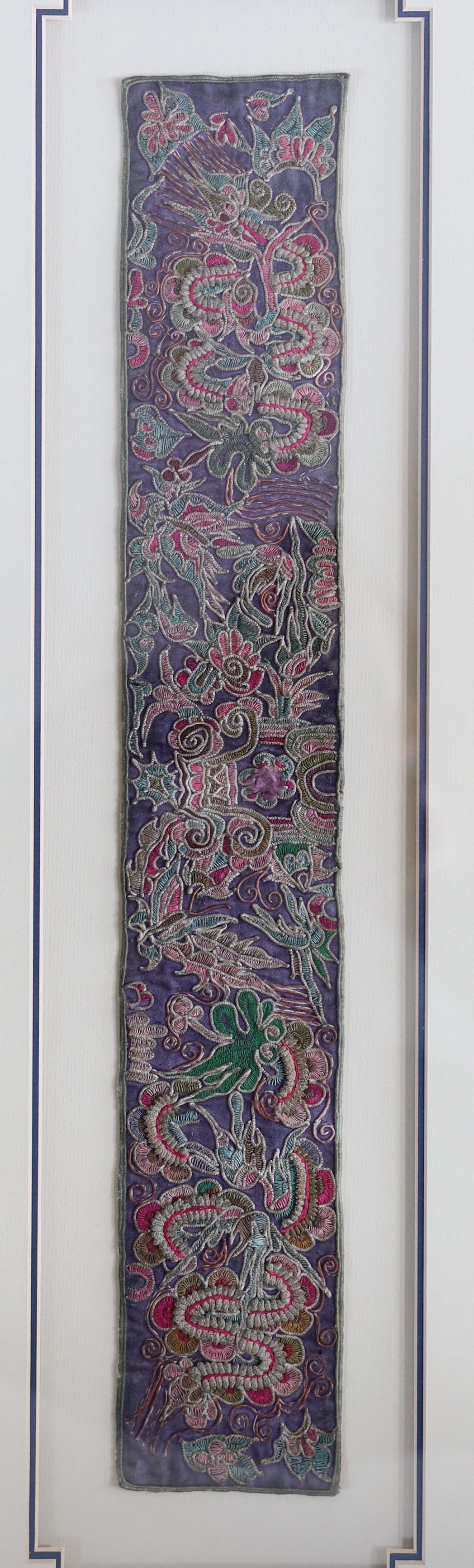 Two 19th century Chinese sleeve bands, embroidered in rich polychromes silks, designed with unusual fine appliqué embroidery, giving the panels a three dimensional effect, largest: 8cm wide, 50cm long